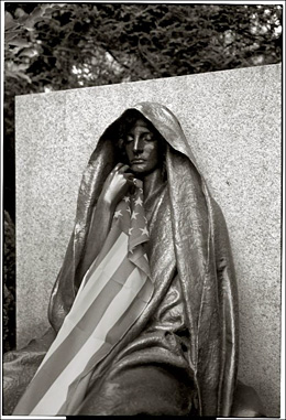 Mourning lady sculpture with flag